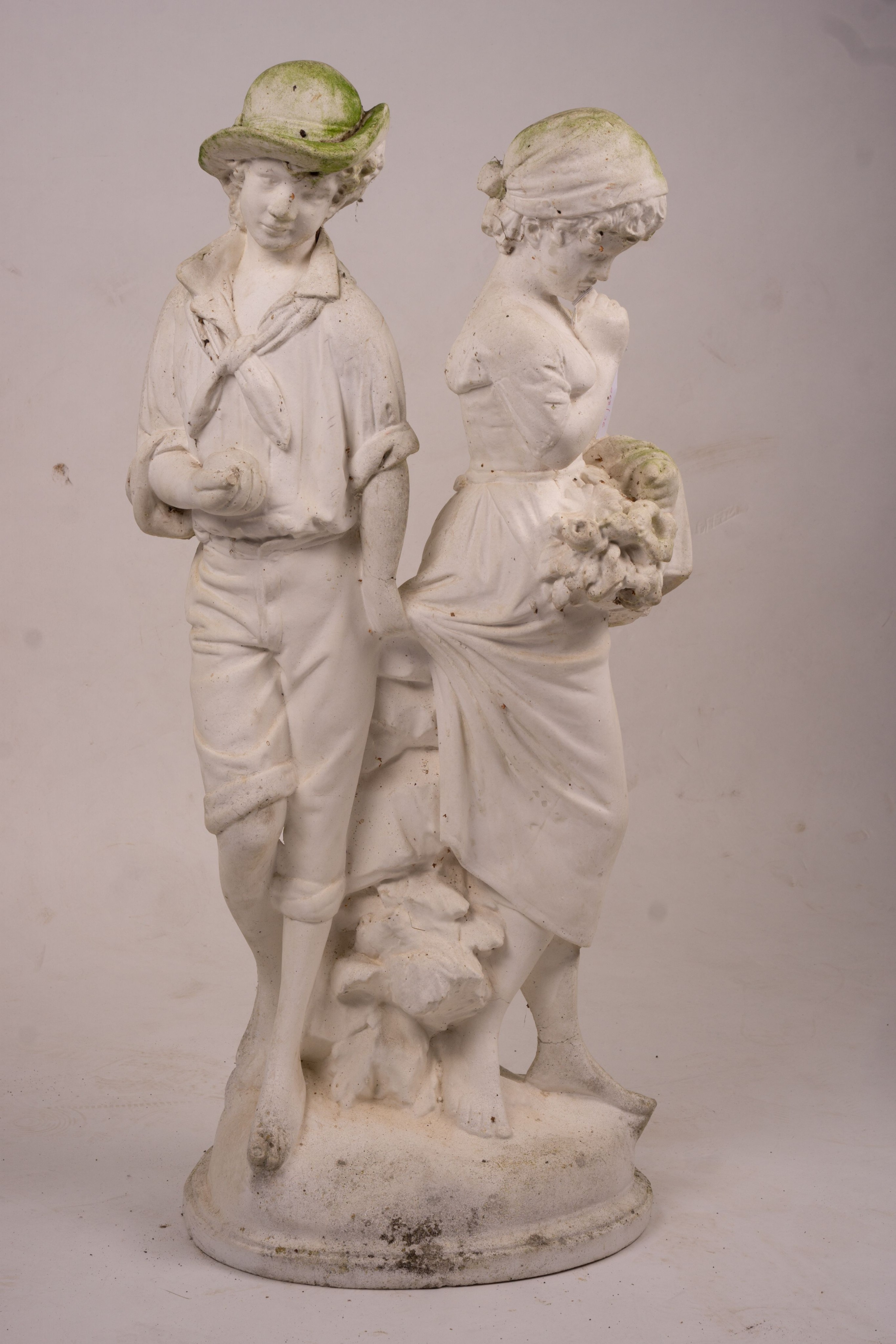 A reconstituted stone garden ornament of fruit and flower pickers, height 89cm